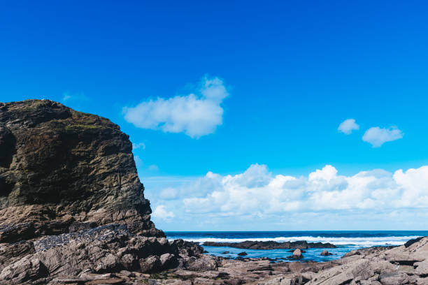 istock Rocky Coast at Whipsiderry Beach, Newquay, Cornwall, September Sunny day. 670448008