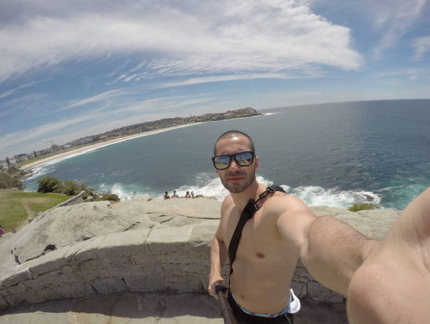 istock Man taking a selfie in Manly Beach, Sydney, Australia 670448050