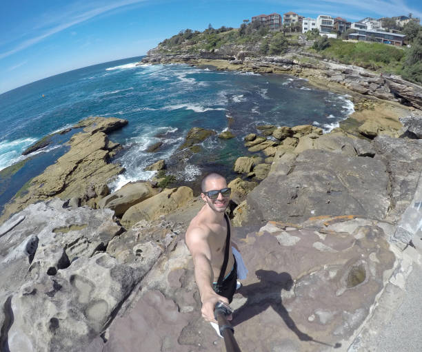 istock Man taking a selfie in Manly Beach, Sydney, Australia 670448052