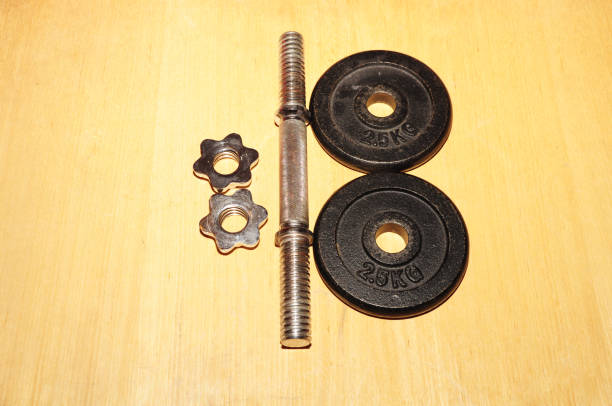 istock Fitness exercise equipment dumbbell weights pickups 670448732