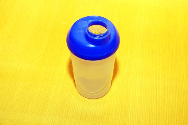 istock Plastic protein shaker on the floor of gym 670449234