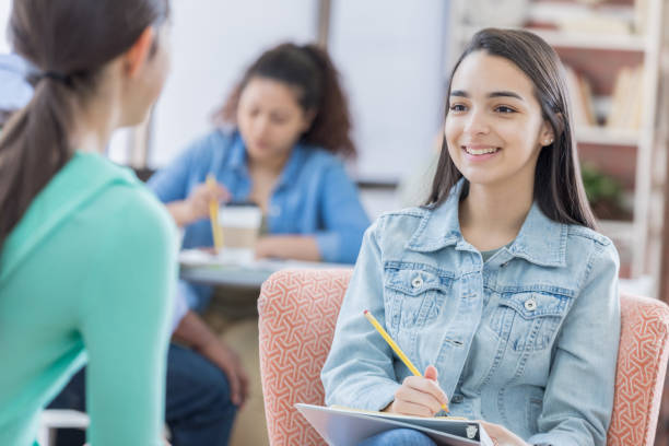 istock High school student talks with school counselor 670449450