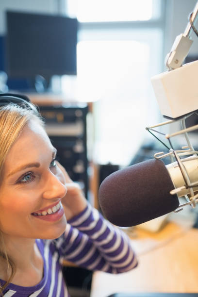 istock Female radio host broadcasting in studio 670450354