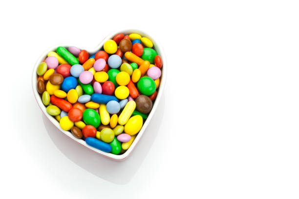 istock Colorful candies in a heart shaped bowl 670453342
