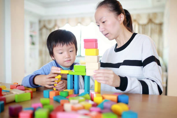 istock Cute asian Children playing with blocks 670463926