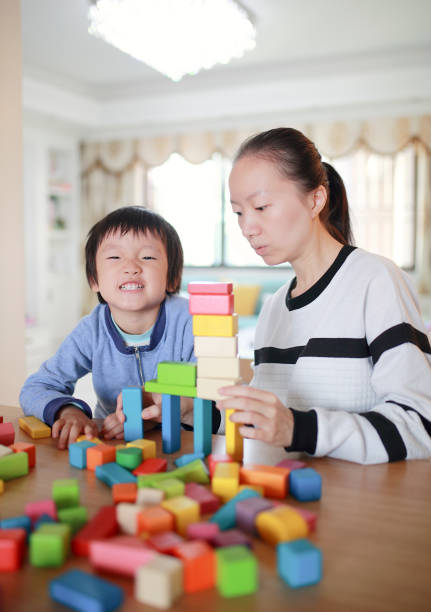 istock Cute asian Children playing with blocks 670464304