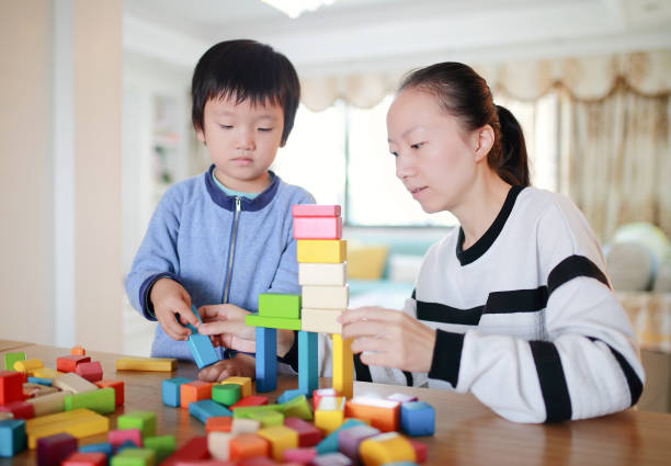 istock Cute asian Children playing with blocks 670464334