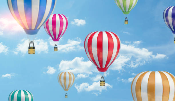 istock Many differently colored striped air balloons flying in the clouded sky 670468234