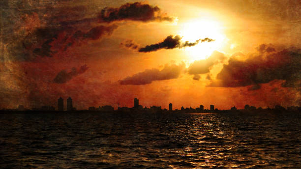 istock Very Light Dark Old Image of Evening Time with the Sun Above Miami 670471020