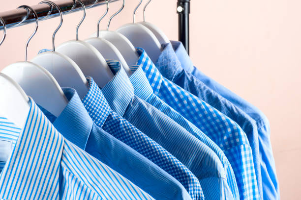 istock Cloth Hangers with Shirts. Men's clothes 670471518