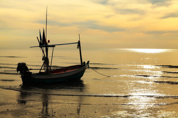 istock Fishing boat at sunset in Hua Hin 670471872