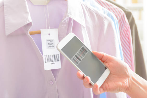 istock Woman scanning barcode with mobile phone 670472274