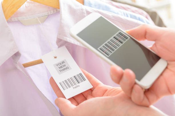 istock Woman scanning barcode with mobile phone 670472316