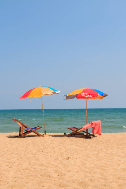 istock Beach chair and umbrella 670473378