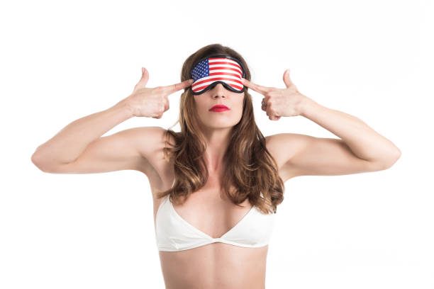 istock Young woman wearing eyemask. American Dream concept. 670473684
