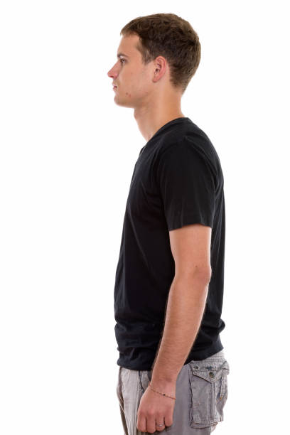 istock Profile view of young man standing 670476190