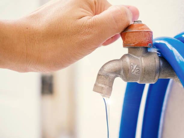istock shut the faucet by hand , think for water saving no need water leak 670476300