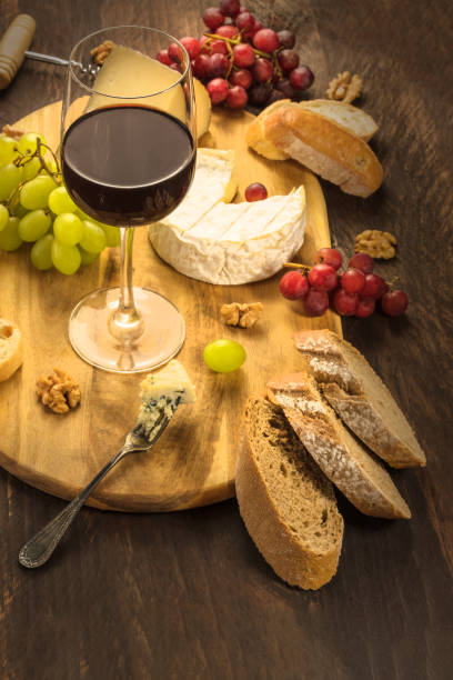 istock Wine and cheese tasting with bread and grapes 670480344