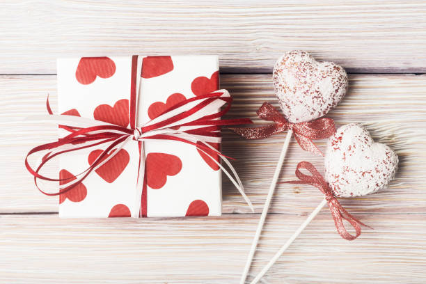 istock Gift box on Valentine’s day over light wooden background 670484672