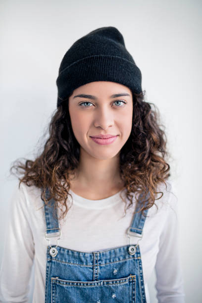 istock Beautiful lesbian standing against white wall 670488228