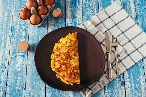 Homemade omelet on wooden table