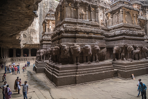 Ellora, India - 15th August 2016: People visiting to the caves in Ellora, Maharashtra state in India