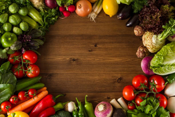 istock Frame of Fresh Vegetables on Wooden Background with Copy Space 670494166