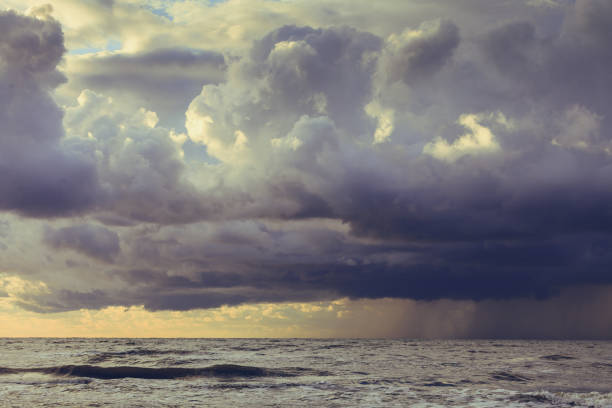 istock Beginning of the storm rain in ocean, dark cloudy sky 670494428