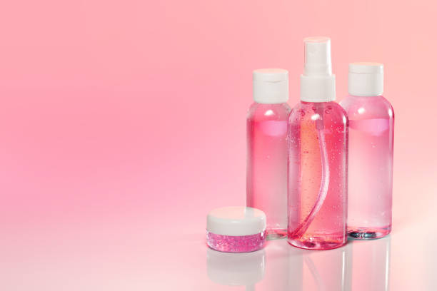 beauty products on pale pink background