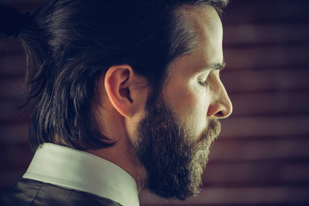 istock Side view of thoughtful man with eyes closed 670499172