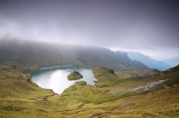istock clouds over alpine lake Schrecksee in mountains 670499348