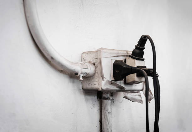 istock Close up of Old Multiple electricity plugs on old adapter risk overloading and dangerous. 670505526