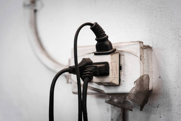 istock Close up of Old Multiple electricity plugs on old adapter risk overloading and dangerous. 670505542