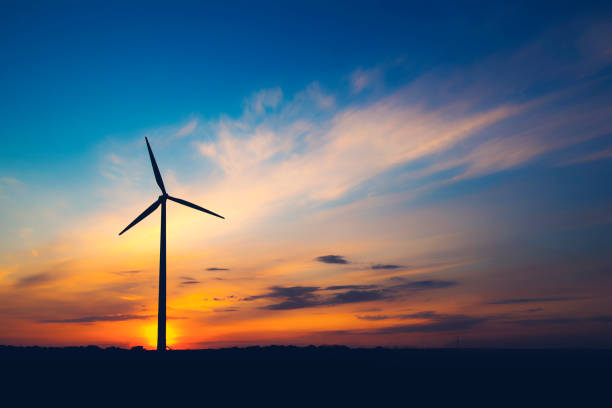 istock The wind farm is turning against the sky 670506062