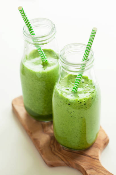 istock healthy green spinach smoothie with cilantro lime banana ginger 670506488