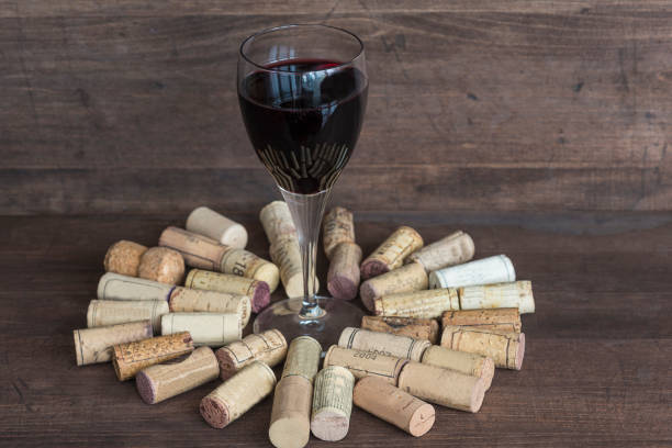 istock glass of red wine and corks 670510044