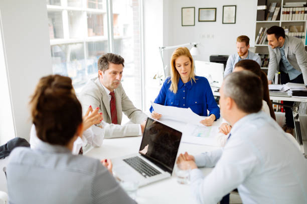 istock Businesspeople and architects planning for the future 670511284