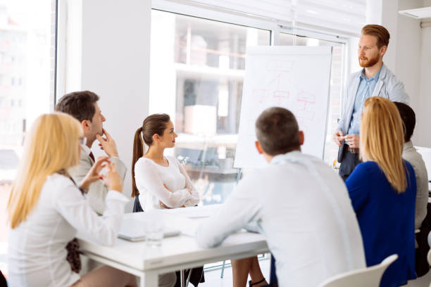istock Businesspeople collaborating and talking through new ideas in office 670514060