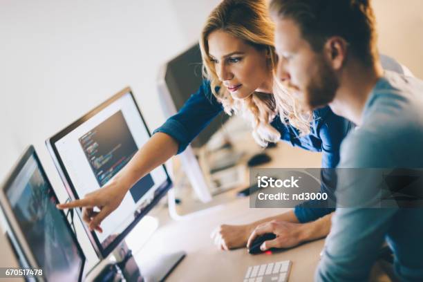 Programmer Working In A Software Developing Company Office Stock Photo - Download Image Now