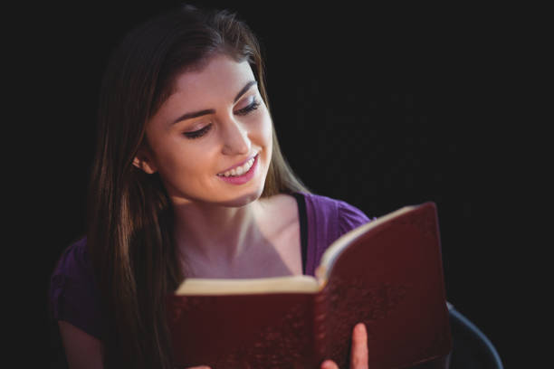 istock Woman praying with her bible 670520828