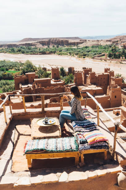 istock Woman drinking tea in Ait Ben Haddou Casbah 670524398