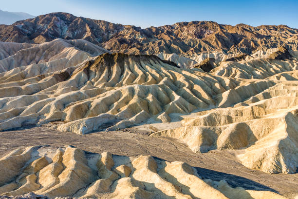istock Picturesque soft waves from multi-coloured sandstone. Death valley, Zabriski 670536486