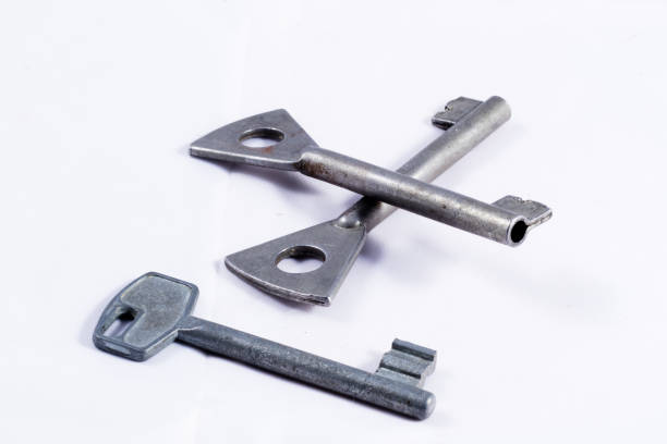 istock Old metal keys on a white background 670540196