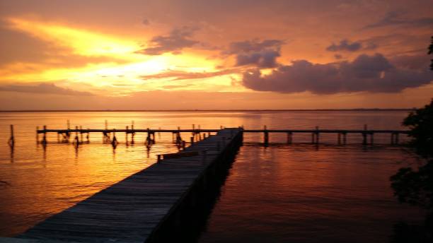 istock Cancun Mexico Boat Dock at Sunset with clouds 670546826