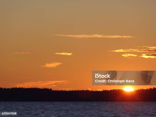 Red Horizon With Clouds And Sunset Over The Vättern In Sweden Stock Photo - Download Image Now