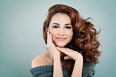 Beautiful Smiling Model Woman with Wavy Hairstyle. Cosmetology and Treatment Concept