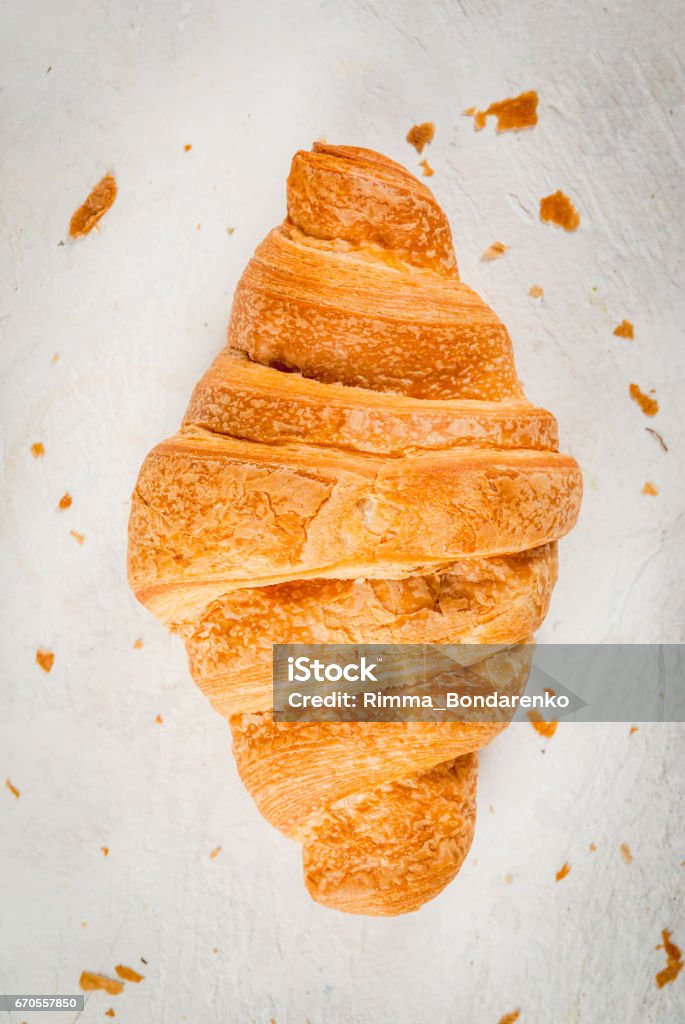 Fresh homemade croissants Fresh homemade croissant on a white concrete table. Top view copy space Baked Pastry Item Stock Photo