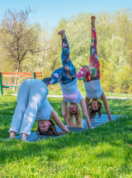 istock Group girl doing yoga 670560058