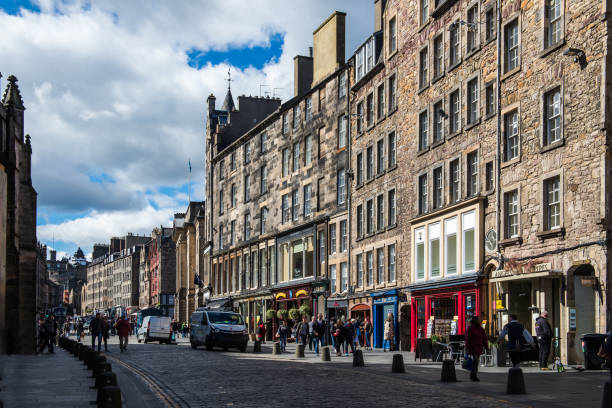 EDINBURGH, SCOTLAND Royal Mile EDINBURGH, SCOTLAND - APRIL 10, 2017: Busy Royal Mile (The Highstreet) in Edinburgh. This street is one of the most iconic street in Scotland and a major tourist attraction with shops and bars. royal mile stock pictures, royalty-free photos & images
