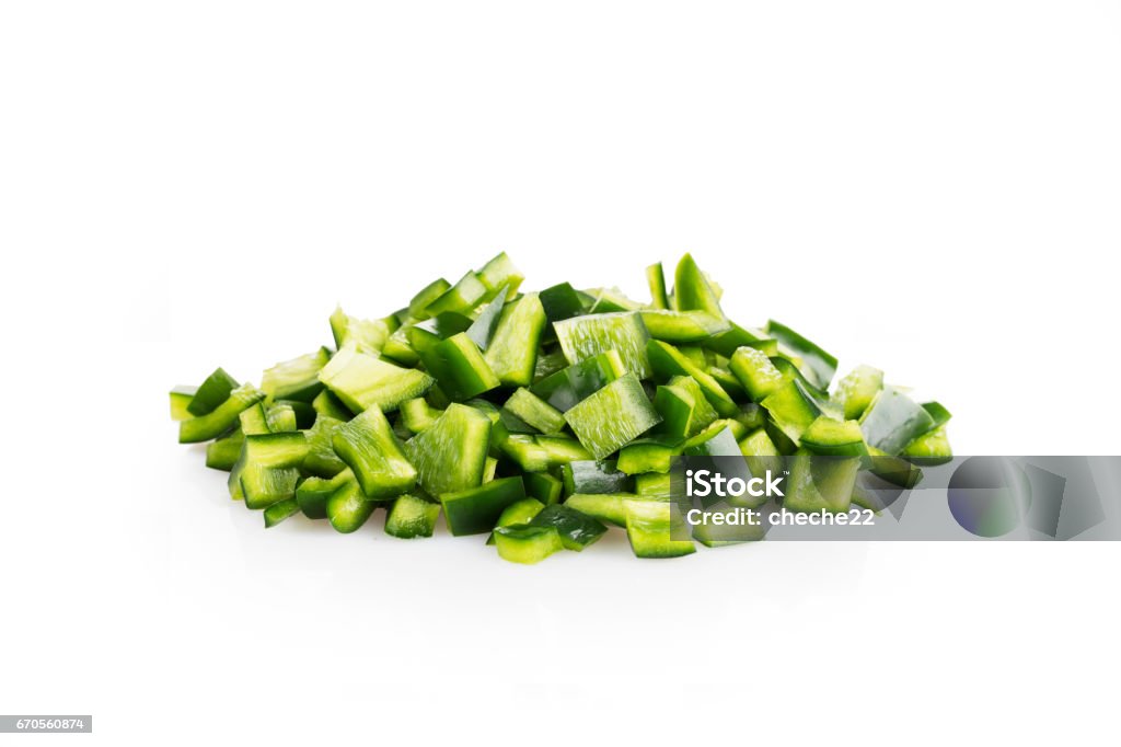 Poblano Peppers on White Fresh chopped poblano peppers on white background with shadow. Chopped Food Stock Photo